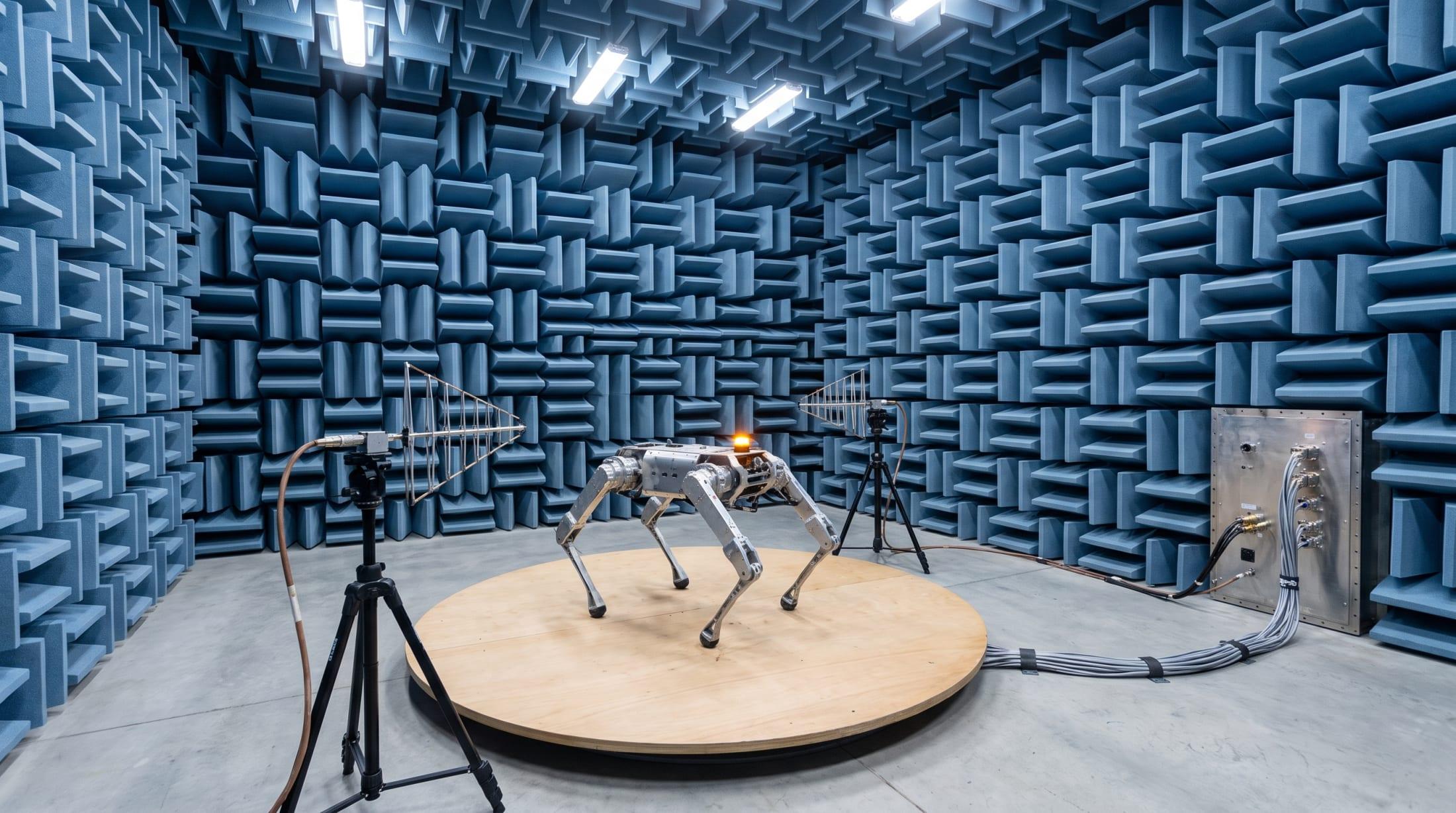 Electromagnetic compatibility test laboratory with a quadruped robot on a measurement turntable